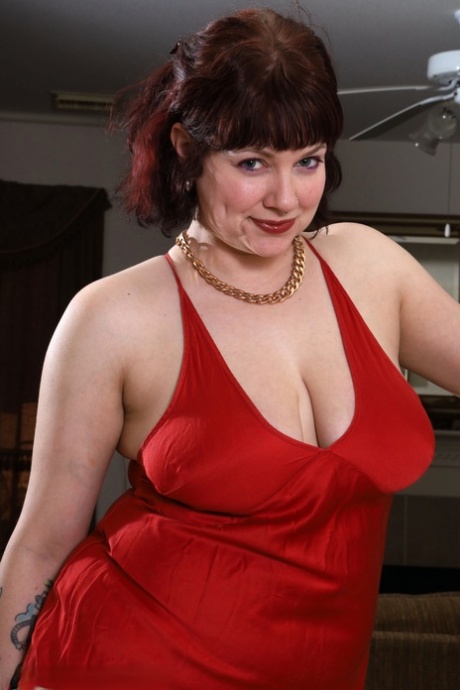 Over 30 Plumper Satine Removes A Red Gown While Getting Totally Naked