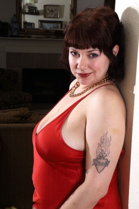 Over 30 Plumper Satine Removes A Red Gown While Getting Totally Naked