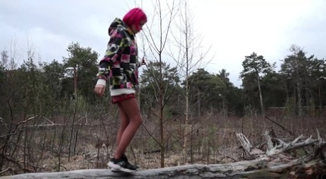 Solo Girl With Pink Hair Vasya Takes A Pee Over The Top Of Some Windfall