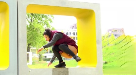 Lara Fox Squats For A Badly Needed Piss Upon A Public Art Installation