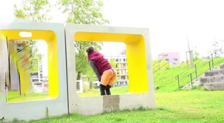 Lara Fox Squats For A Badly Needed Piss Upon A Public Art Installation