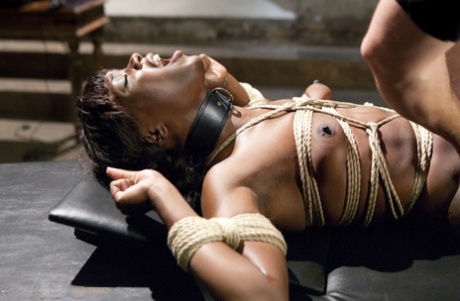 A sexually charged ebony slave is forced to perform a brutal blow while being bound in bondage.