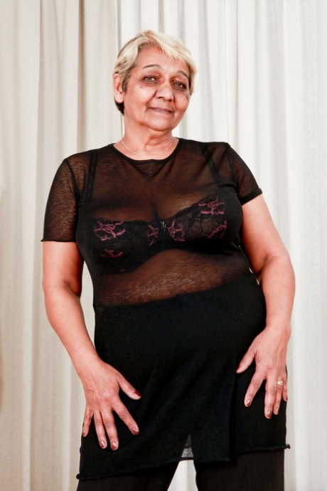 Fat granny Evika models in her bra and underwear during solo action