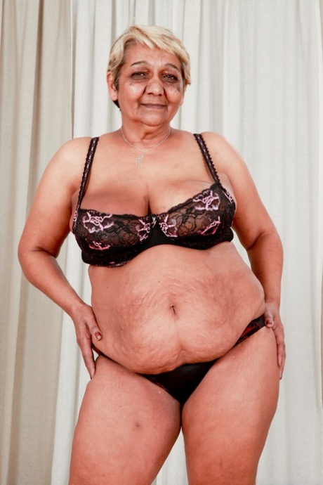 Fat granny Evika models in her bra and underwear during solo action