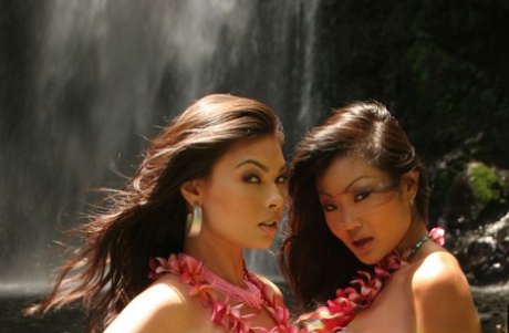 Asian Model Tera Patrick And A Girlfriend Poses In Bikinis Afore A Waterfall