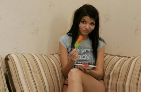 Barely legal teen Kaira 18 gets naked while eating a Frozen treat on a couch
