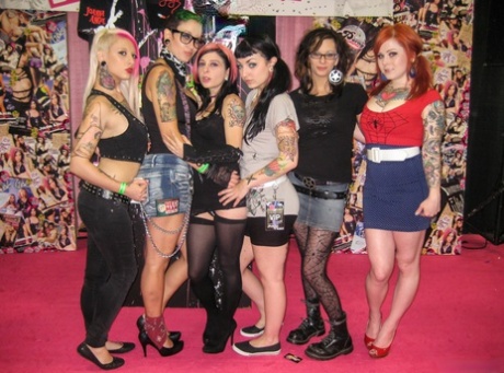 Amateur chick Joanna Angel and girlfriends greet fans at an adult trade show