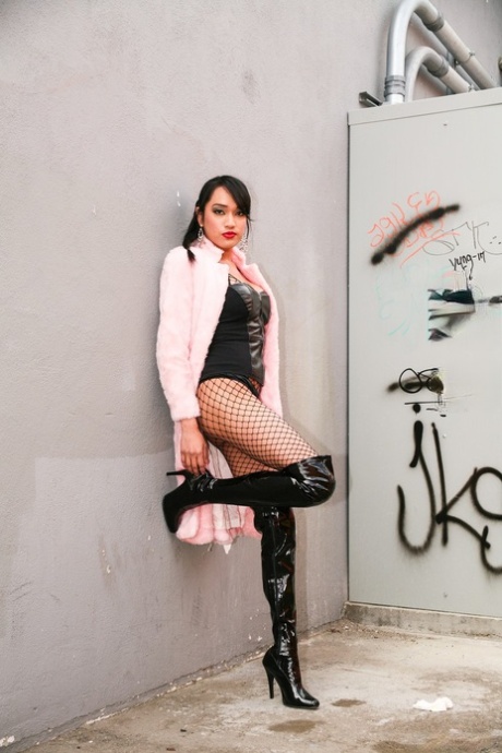 Asian Beauty Jessica Fox Models Leather Lingerie In Fishnets And OTK Boots