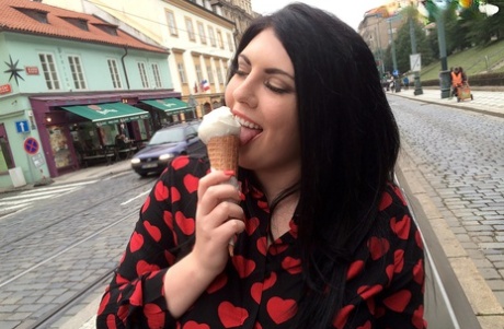 Chubby brunette chick Maya Milano eats and ice cream cone in teasing manner