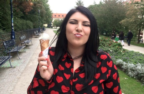 Chubby brunette chick Maya Milano eats and ice cream cone in teasing manner