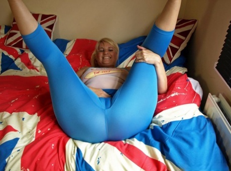 Daniella English, an older woman, stretches out her spandex trousers over her large rear end.