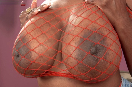 Ebony MILF Camille Morgan Unveils Great Tits To Model Naked In Red Fishnet
