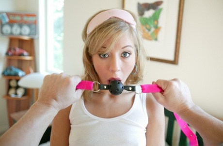 In BDSM doggystyle, Young Chastity Lynn was gagged, clamped and hammered.