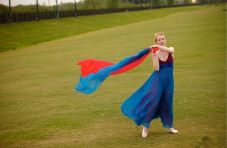 Nicki Blue, a natural redhead on the dance floor, practices her ballerina moves in a vast area.