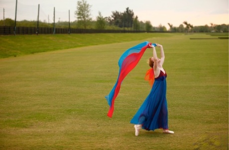 Natural redhead Nicki Blue works on her ballerina moves in an extensive field (file picture) She is a natural performer and dancer with the stars.