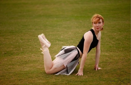 Nicki Blue, a natural redhead on the dance floor, practices her ballerina moves in a vast area.