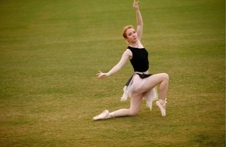 Nicki Blue, a natural redhead on the dance floor, practices her ballerina moves in a vast area.