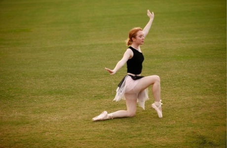 Working in an extensive field of view, natural redhead Nicki Blue hones her ballerina skills as she works on improving.