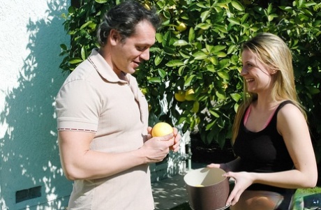 An innocent girl caught on camera picking fruit from a tree before having sex is named Denice K.