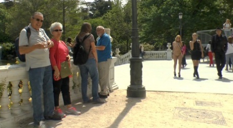 Prior to being gangbanged, a naked girl is shown walking in public.