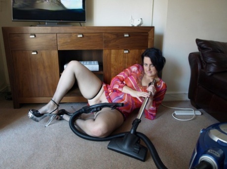 A full-grown fat wife gets stimulated and plays with the vacuum cleaner.
