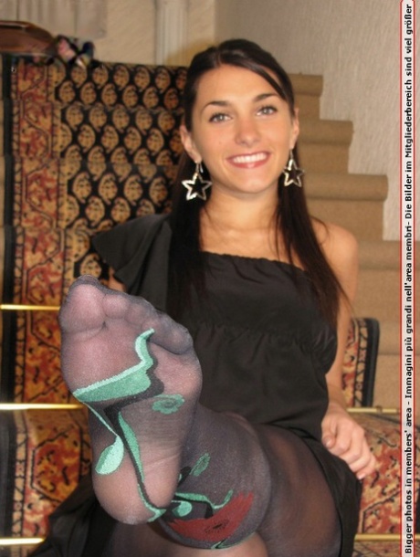 Clothed Female Kicks Off Her Black Pumps In The Sexiest Of Nylons