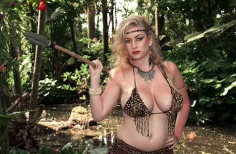 Her male captors suckle the big breasts of blonde Kali West, who is a spear chucker.