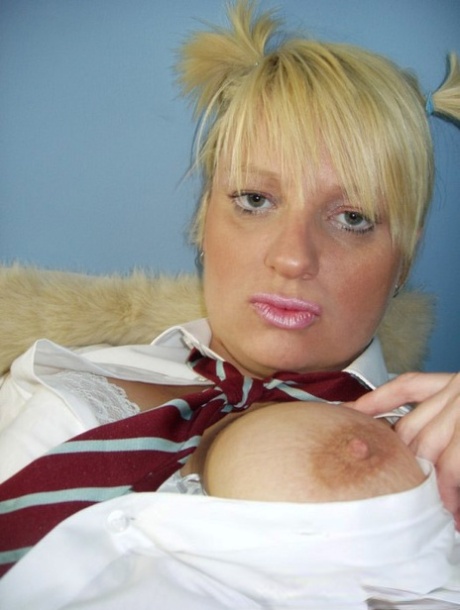 Older UK amateur Daniella English slides panties aside in schoolgirl attire