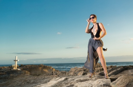 While on the beach, Roni Ford displays her sexy looks with heels.