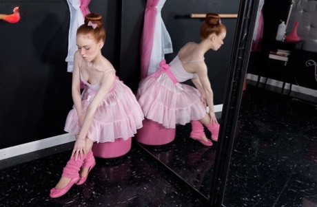 Little, the redhead ballerina, strips down to pink leg warmers and slippers for her appearance.