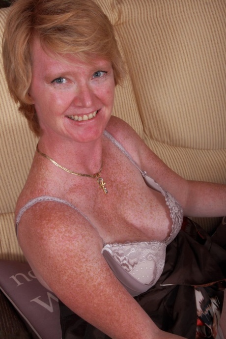 Horny Granny Laughingly Displays The Wet Cameltoe Under Her Sheer Undies