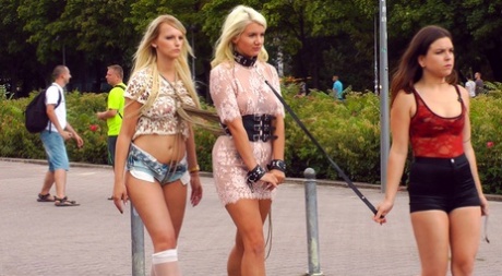 Before outdoor blowjobs and public fucking, blonde slaves are paraded in the streets.