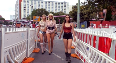 Blonde slaves are publicly paraded before being treated to outdoor blowjobs and public fucking.