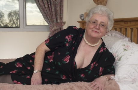 Although she is no longer old, Granny remains horny and frequently plays with her fat-filled vagina on the bed.