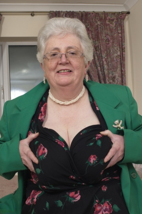 Even though she has aged, Granny remains horny and frequently plays with her heavy vagina on the bedside table.