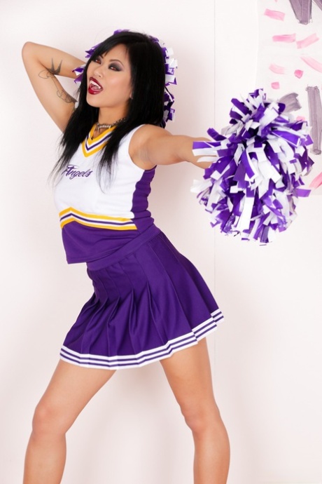 Asian cheerleader Krissie Dee does not wear her uniform while wearing running shoes.