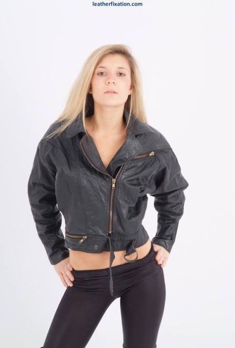 Blond Chick Unzips Her Leather Jacket In A Black Bra And Leggings