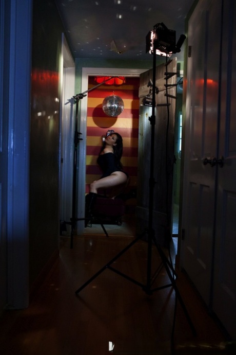 London Keyes, an Asian solo girl, displays her tits and movements by placing it near a payphone.