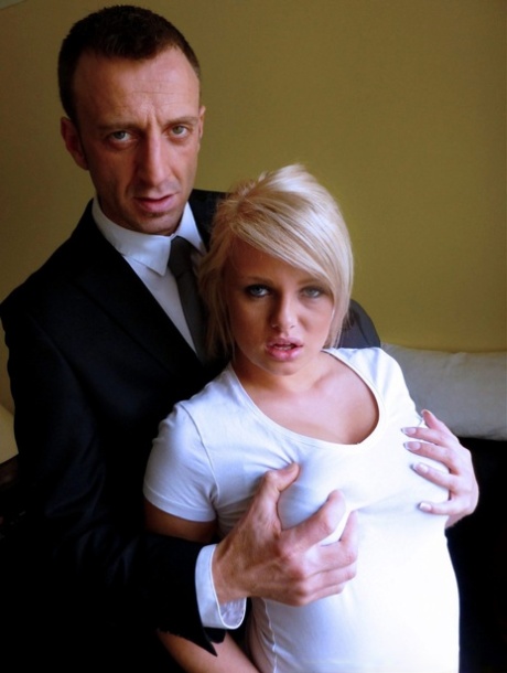 British amateur groom Bonnie Rose gives a businessman a shaved facial hair.