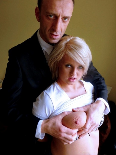 Bonnie Rose, a British amateur athlete, gives her shaved facial hair to a businessman.
