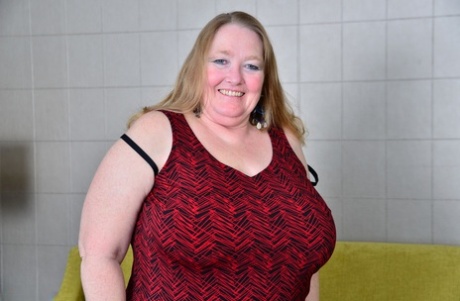 Maneuvering her saggy old breasts, British beauty contestant BBW uses mesh nylon and black boots to keep them free.