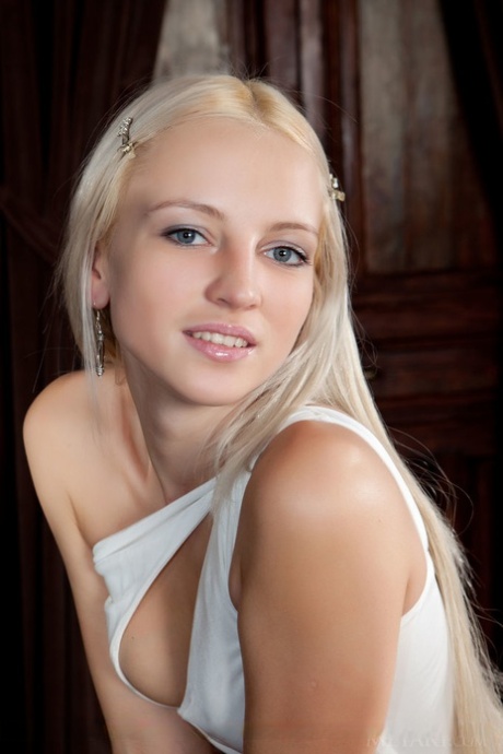 Sensual blonde teen Alysha removes her dress to show off her muff