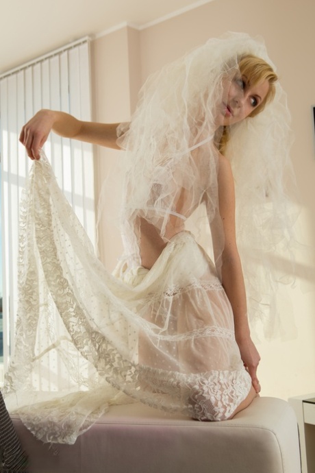 Wearing her sheer white lingerie, the beautiful bride Toni spreads herself naked.