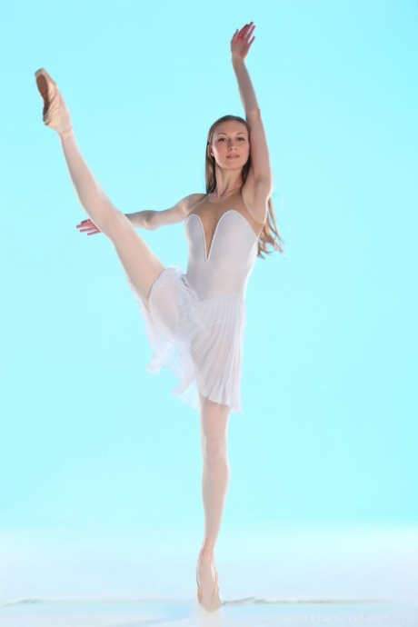 Annett A, the flexible dancer, removes her pantyhose and white skirt to reveal tiny tits.