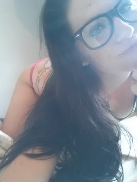 Her orgasmic exudation is evident in Freckles' amateur lascivious behavior at 18 years old, with a bespectacled expression.