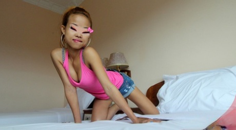 Tiny Cambodian Teen Hides Her Face Behind A Mask While Fucking A Farang