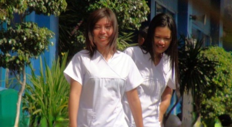 Joanna and Joy, two Asian nurses, participate in a hairy pussy threesome, where they drop their pants.
