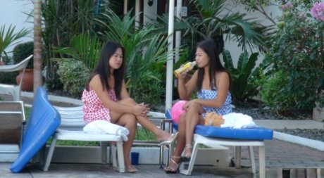 Nicole and Anne, both Filipina sisters in bikinis, dribbled before a POV threesome.