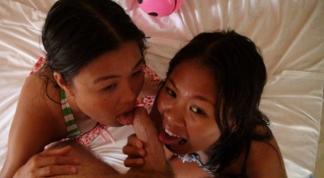 Before joining in on a POV threesome, Nicole and Anne, both Filipina sisters, take off their bikinis.