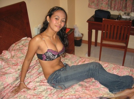 Amateur Asian teen poses in tight jeans and disrobes to give a naked blowjob